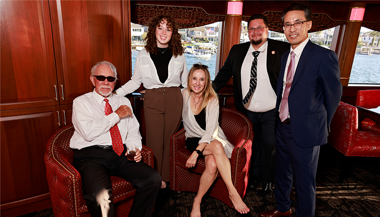 Jim taking a photo with other interns