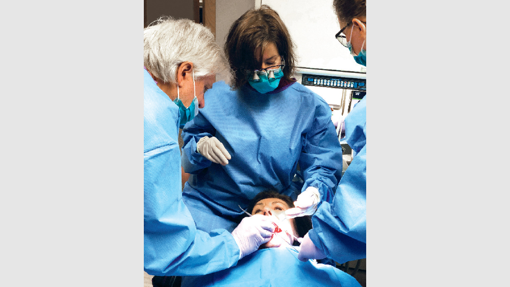 Dr. Tilley placing implants on patient