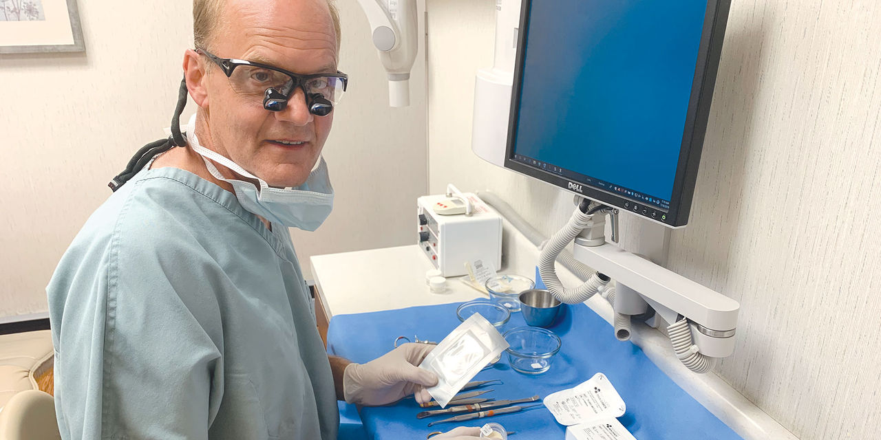 Dentist working with tools