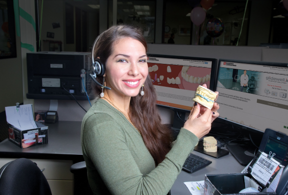 woman holding dental mold