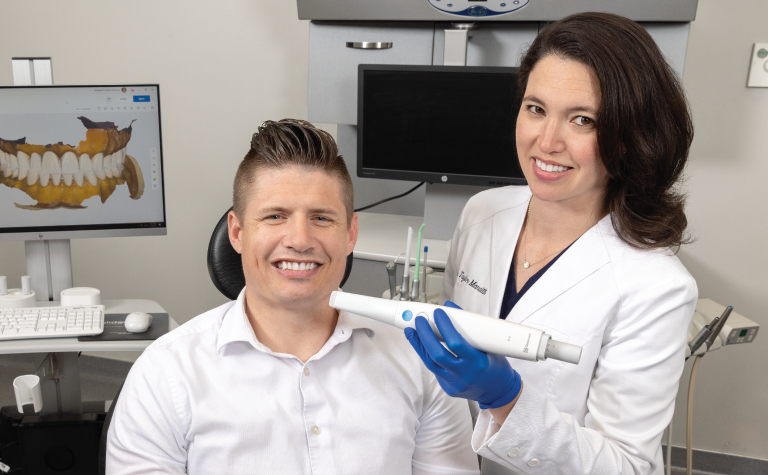 Dr. Manalilli with patient and intraoral scanner Dr. Manalilli with patient and intraoral scanner